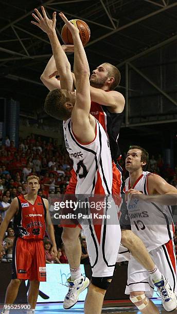 Jesse Wagstaff of the Wildcats shoots over Tim Behrendorff of the Hawks during the round 14 NBL match between the Perth Wildcats and the Wollongong...