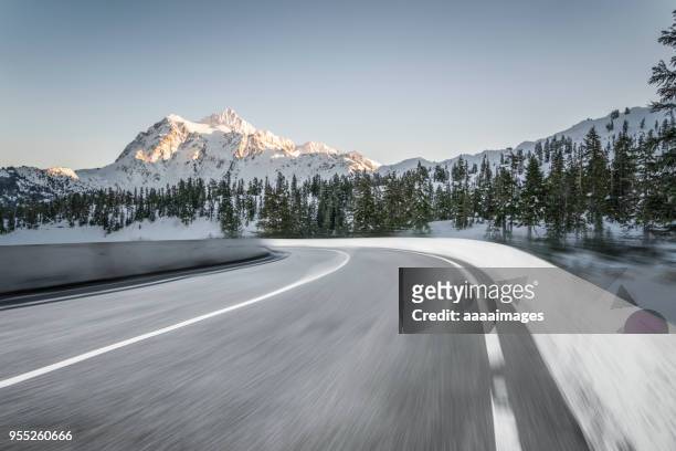 blurred motion mountain road,mt.baker - snow road stock-fotos und bilder