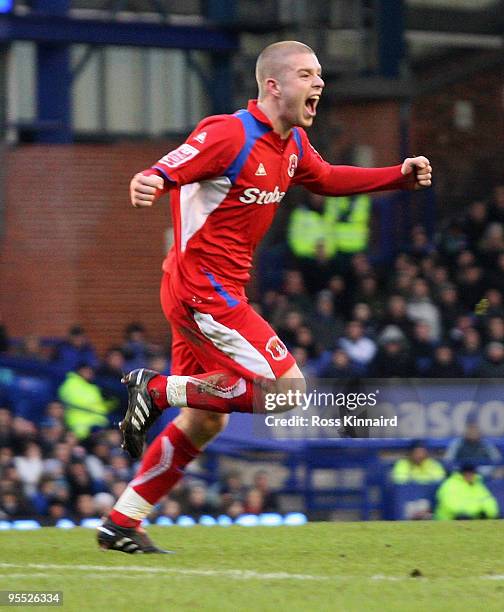 Adam Clayton of Carlisle celebrates his team's first goal after his shot was deflected in by teammate Kevan Hurst during the third round match of The...