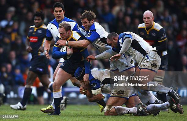 Lee Blackett of Leeds is tackled by the Bath defence during the Guinness Premiership match between Leeds Carnegie and Bath at Headingley Stadium on...