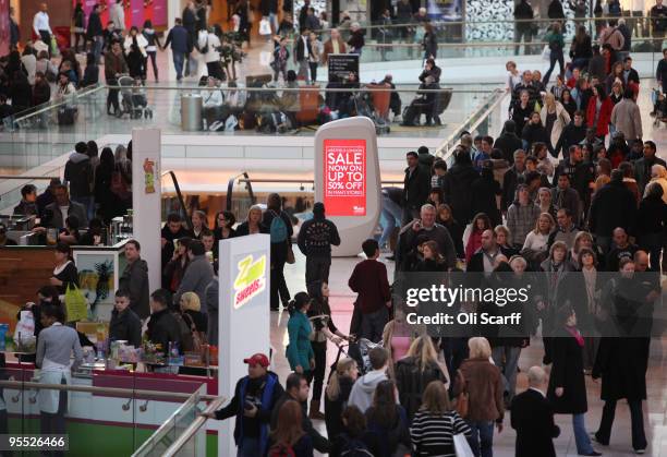 Shoppers peruse the sales in the giant Westfield shopping centre on January 2, 2010 in London, England. High street retailers have reported better...