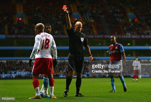 Referee Howard Webb sends off Blackburn striker El-Hadji Diouf during the FA Cup sponsored by E.ON 3rd Round match between Aston Villa and Blackburn...