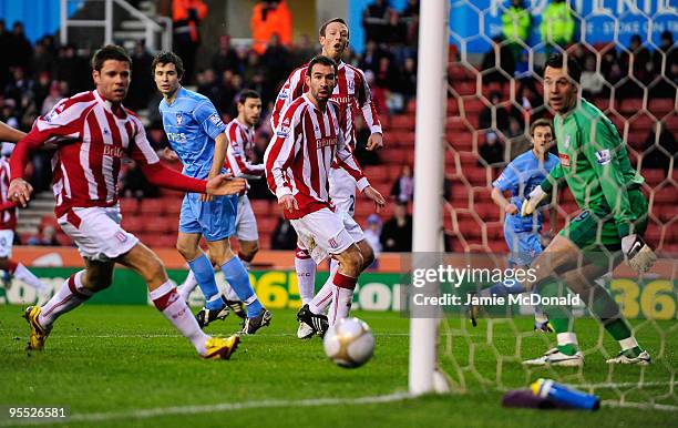 Neil Barrett of York City scores during the FA Cup sponsored by E.ON 3rd Round match between Stoke City and York City at the Britannia Stadium on...