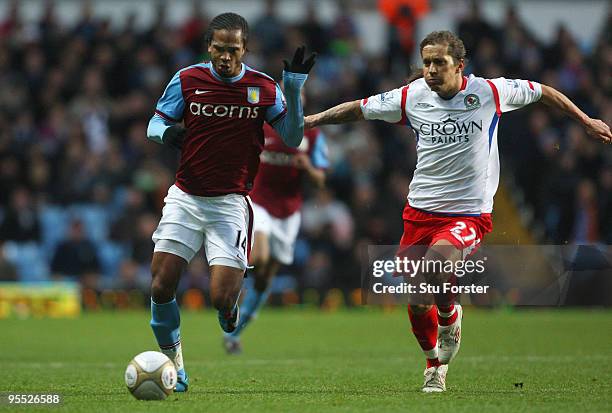 Villa striker Nathan Delfounseo battles for the ball with Michael Salgado of Blackburn during the FA Cup sponsored by E.ON 3rd Round match between...