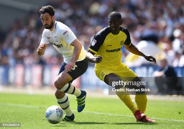 Greg Cunningham of Preston North End is challenged by Marvin Sordell of Burton Albion during the Sky Bet Championship match between Preston North End...