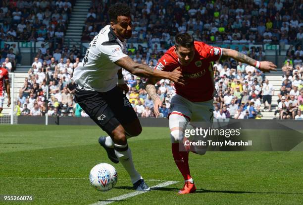 Tom Huddlestone of Derby County tackles Adam Hammill of Barnsley during the Sky Bet Championship match between Derby County and Barnsley at iPro...