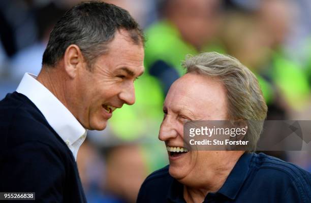 Paul Clement, Manager of Reading speaks to Neil Warnock, Manager of Cardiff City prior to the Sky Bet Championship match between Cardiff City and...