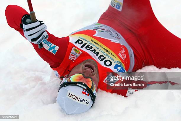 Petter Northug of Norway lies in the snow after winning the Men's 15km Pursuit of the FIS Tour De Ski on January 2, 2010 in Oberhof, Germany.