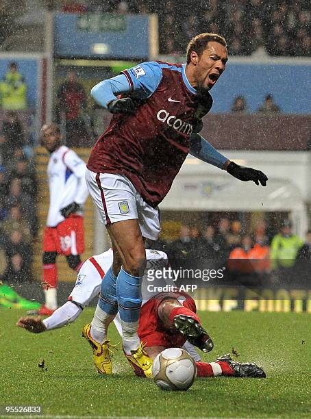 Aston Villa's Norwegian forward John Carew is fouled for a penalty by Blackburn Rovers' French defender Gael Givet during the FA Cup third round...