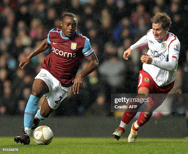 Aston Villa's English midfielder Nigel Reo-Coker vies with Blackburn Rovers' Norwegian midfielder Morten Gamst Pedersen during the FA Cup third round...