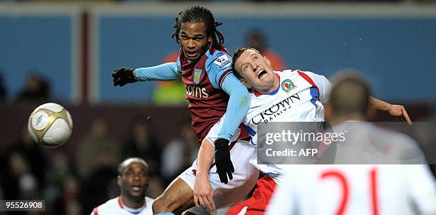 Blackburn Rovers' English defender Phil Jones vies with Aston Villa's English forward Nathan Delfouneso during the FA Cup third round football match...