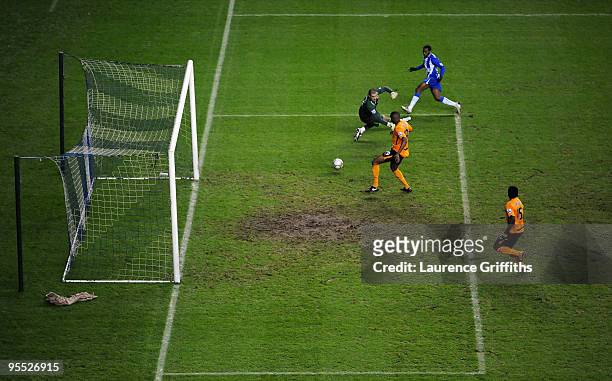 Charles N'Zogbia of Wigan scores the equaliser past goalkeeper Boaz Myhill of Hull during the The FA Cup sponsored by E.ON Third Round match between...