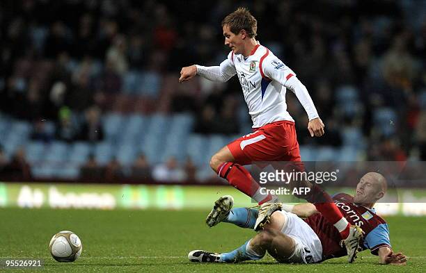 Aston Villa's Welsh defender James Collins vies with Blackburn Rovers' Norwegian midfielder Morten Gamst Pedersen during the FA Cup third round...