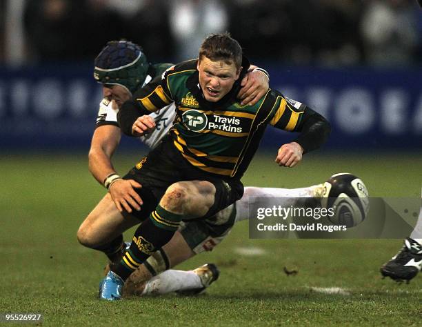 Chris Ashton of Northampton moves past Kieran Roche during the Guinness Premiership match between Northampton Saints and London Irish at Franklin's...