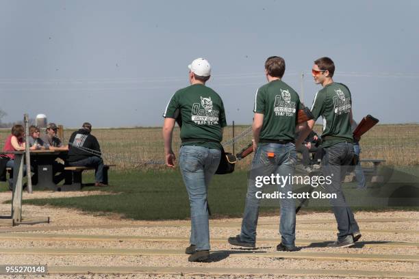 Students from the Osage High School trap team compete in a trapshooting match at the Mitchell County Trap Range on May 5, 2018 in Osage, Iowa. The...