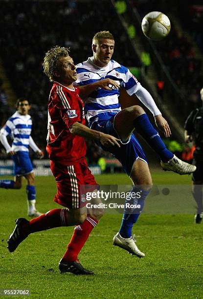 Matthew Mills of Reading challenges Dirk Kuyt of Liverpool during the FA Cup 3rd Round match sponsored by e.on between Reading and Liverpool at the...