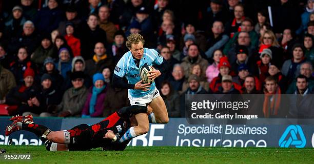 Scott Hamilton of Leicester Tigers is tackled by Justin Marshall of Saracens during the Guinness Premiership match between Saracens and Leicester...