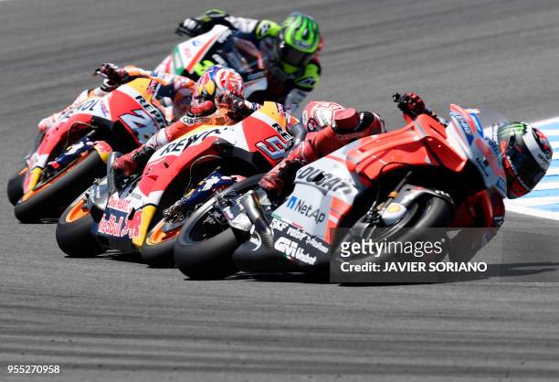 Ducati Team's Spanish rider Jorge Lorenzo , Repsol Honda Team's Spanish rider Marc Marquez and Repsol Honda Team's Spanish rider Dani Pedrosa compete...