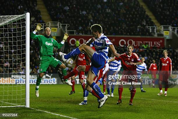 Grzegorz Rasiak of Reading crosses the ball for Simon Church of Reading to scvore as Pepe Reina of Liverpool attempts the stop during the FA Cup 3rd...