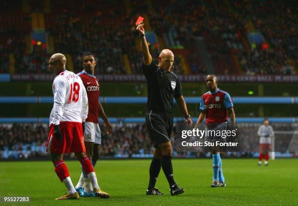 Referee Howard Webb sends off Blackburn striker El-Hadji Diouf during the FA Cup sponsored by E.ON 3rd Round match between Aston Villa and Blackburn...