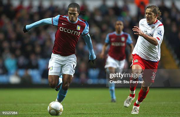 Villa striker Nathan Delfounseo battles for the ball with Michael Salgado of Blackburn during the FA Cup sponsored by E.ON 3rd Round match between...