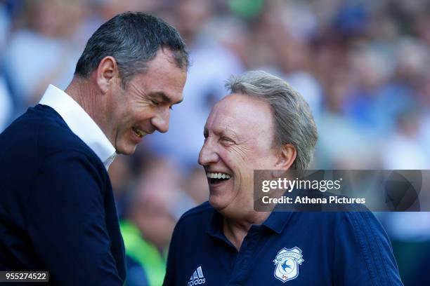 Reading manager Paul Clement laughs with Cardiff City manager Neil Warnock prior to kick off of the Sky Bet Championship match between Cardiff City...