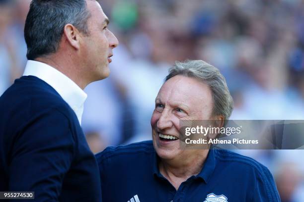 Reading manager Paul Clement laughs with Cardiff City manager Neil Warnock prior to kick off of the Sky Bet Championship match between Cardiff City...