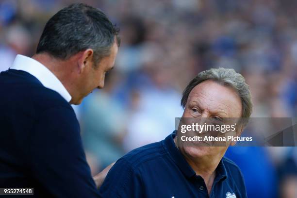 Reading manager Paul Clement shakes hands with Cardiff City manager Neil Warnock prior to kick off of the Sky Bet Championship match between Cardiff...