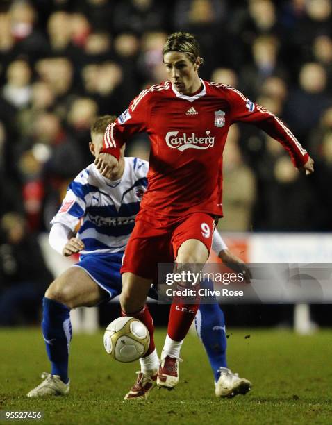 Matthew Mills of Reading challenges Fernando Torres of Liverpool during the FA Cup 3rd Round match sponsored by e.on between Reading and Liverpool at...