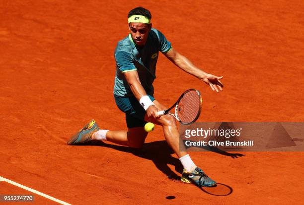 Nicolas Kicker of Argentina plays a backhand against Taylor Fritz of the United States in their first round match during day two of the Mutua Madrid...