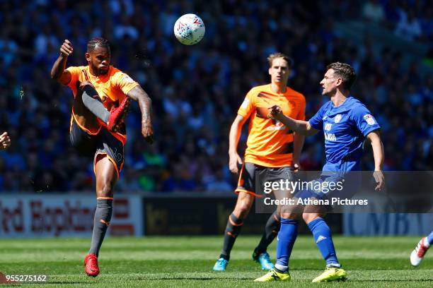 Leandro Bacuna of Reading is marked by Craig Bryson of Cardiff City during the Sky Bet Championship match between Cardiff City and Reading at The...