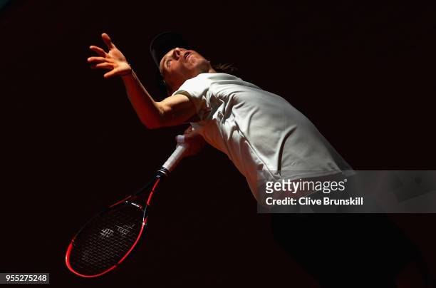 Denis Shapovalov of Canada serves against Tennys Sandgren of the United States in their first round match during day two of the Mutua Madrid Open...