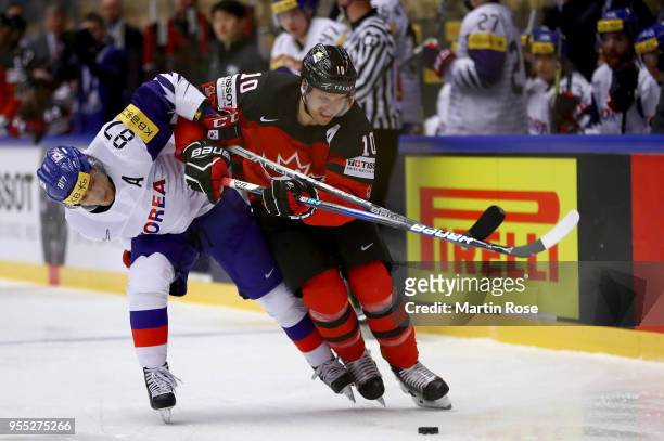Minho Cho of Korea and Brayden Schenn of Canada battle for the puck during the 2018 IIHF Ice Hockey World Championship group stage game between Korea...
