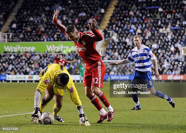 Fabio Aurelio of Liverpool battles with Adam Federici goalkeeper of Reading during the FA Cup 3rd round match between Reading and Liverpool at the...