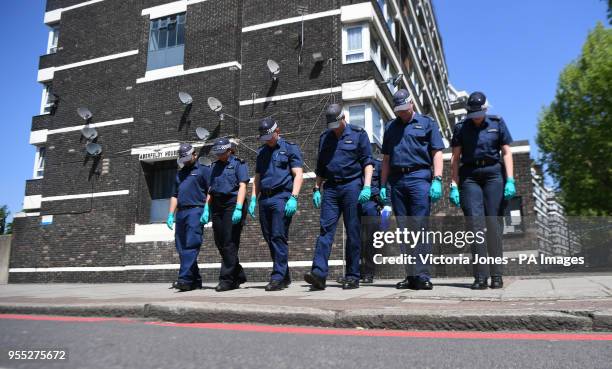 Police search team at the scene ouside Aberfeldy House in Camberwell New Road, Southwark, south London, as 17-year-old Rhyhiem Ainsworth Barton was...