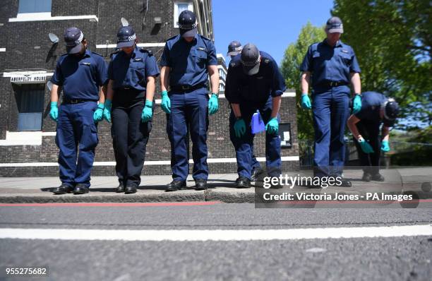 Police search team at the scene ouside Aberfeldy House in Camberwell New Road, Southwark, south London, as 17-year-old Rhyhiem Ainsworth Barton was...