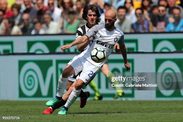 Borja Valero of FC Internazionale in action against Adrija Balic of Udinese Calcio during the serie A match between Udinese Calcio and FC...