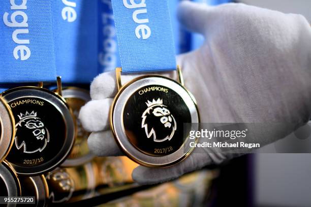View of the premier league winners medals prior to the Premier League match between Manchester City and Huddersfield Town at Etihad Stadium on May 6,...