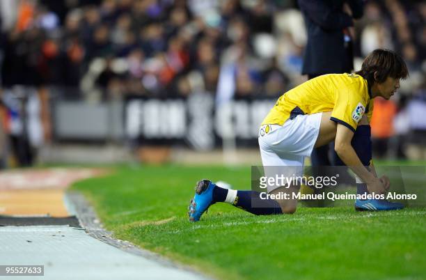 Shunsuke Nakamura of Espanyol warms up on the sideline during the La Liga match between Valencia and Espanyol at Estadio Mestalla on January 2, 2010...