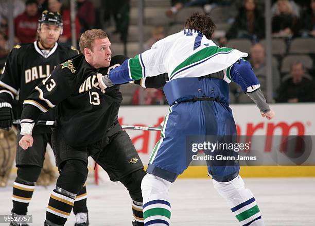 Krys Barch of the Dallas Stars fights with Darcy Hordichuk of the Vancouver Canucks on January 2, 2010 at the American Airlines Center in Dallas,...