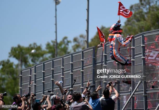 Repsol Honda Team's Spanish rider Marc Marquez celebrates winning the MotoGP race of the Spanish Grand Prix at the Jerez Angel Nieto racetrack in...