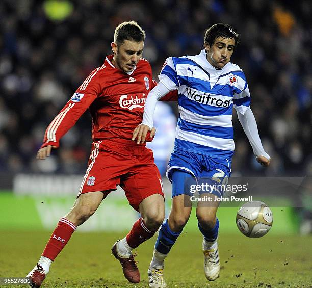 Fabio Aurelio of Liverpool competes with Jem Karacan of Reading during the FA Cup 3rd round match between Reading and Liverpool at the Madejski...