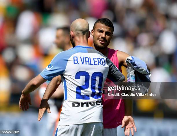 Borja Valero and Rafinha of FC Internazionale celebrate at the end of the serie A match between Udinese Calcio and FC Internazionale at Stadio Friuli...