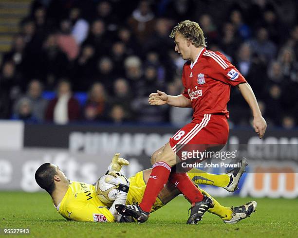 Goalkeeper Ben Hamer of Reading makes a save at the feet of Dirk Kuyt of Liveprool during the FA Cup 3rd round match between Reading and Liverpool at...