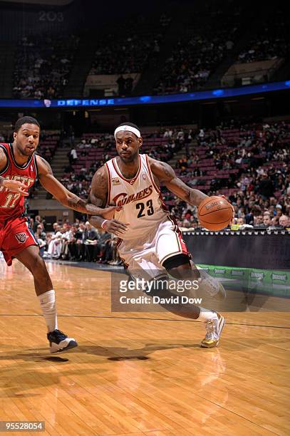 LeBron James of the Cleveland Cavaliers drives against Chris Douglas-Roberts of the New Jersey Nets during the game on January 2, 2010 at the Izod...