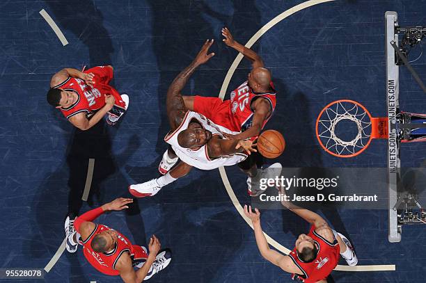 Shaquille O'Neal of the Cleveland Cavaliers shoots against Trenton Hassell of the New Jersey Nets during the game on January 2, 2010 at the Izod...