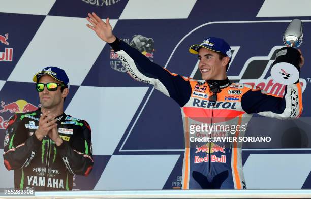 First placed Repsol Honda Team's Spanish rider Marc Marquez and second placed Monster Yamaha Tech 3's French rider Johann Zarco celebrate on the...