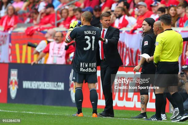 New York Red Bulls Head Coach Jesse Marsch talks with New York Red Bulls goalkeeper Luis Robles during the second half of the Major League Soccer...
