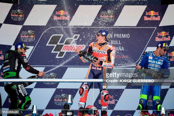 First placed Repsol Honda Team's Spanish rider Marc Marquez , second placed Monster Yamaha Tech 3's French rider Johann Zarco and third placed Team...