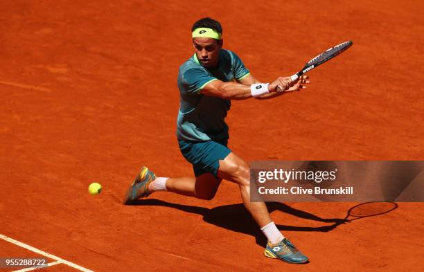 Nicolas Kicker of Argentina plays a backhand against Taylor Fritz of the United States in their first round match during day two of the Mutua Madrid...